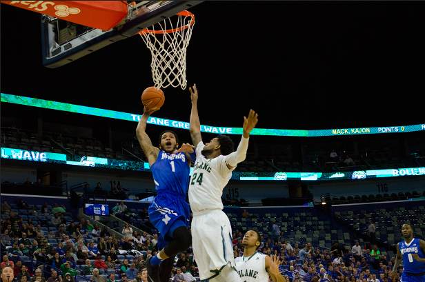 Memphis redshirt freshman Markel Crawford dunks over senior guard Jay Hook in the Tulane 55-57 loss to Memphis Saturday at the Smoothie King Center. Tulane turned the ball over 16 times in the loss. 