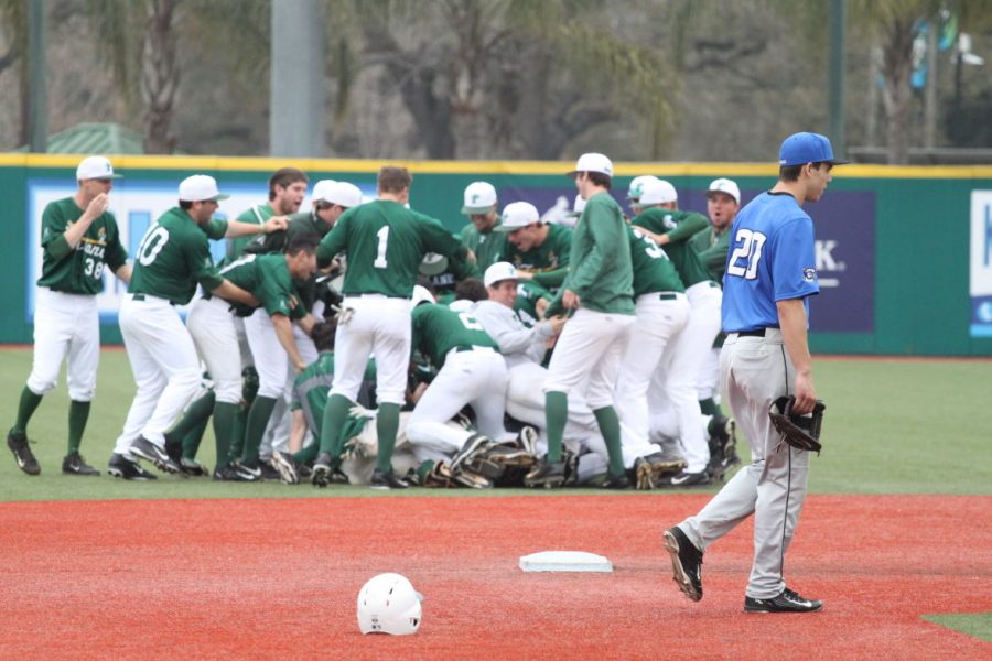 Tulane baseball celebrates after Hunter Hopes walk off RBI-single with two outs in the bottom of the ninth that defeated Creighton 3-2 Sunday at Turchin Stadium. 