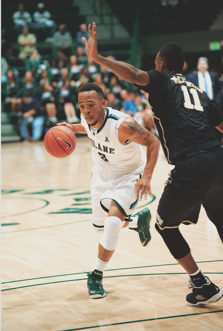 Senior guard Louis Dabney dribbles past Wake Forest opponent in the Nov. 17 2014 face off in Devlin Fieldhouse. Dabney scored 17 points in the 71-49 loss. 