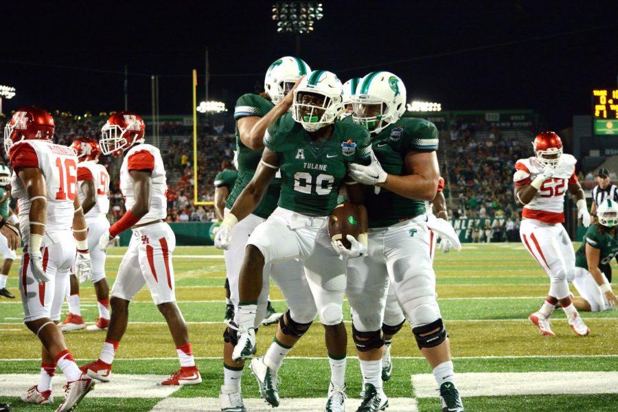 Tulane offensive players celebrate the first and final touchdown in a trying 42-7 loss against Houston on Oct. 17 at Yulman Stadium. 