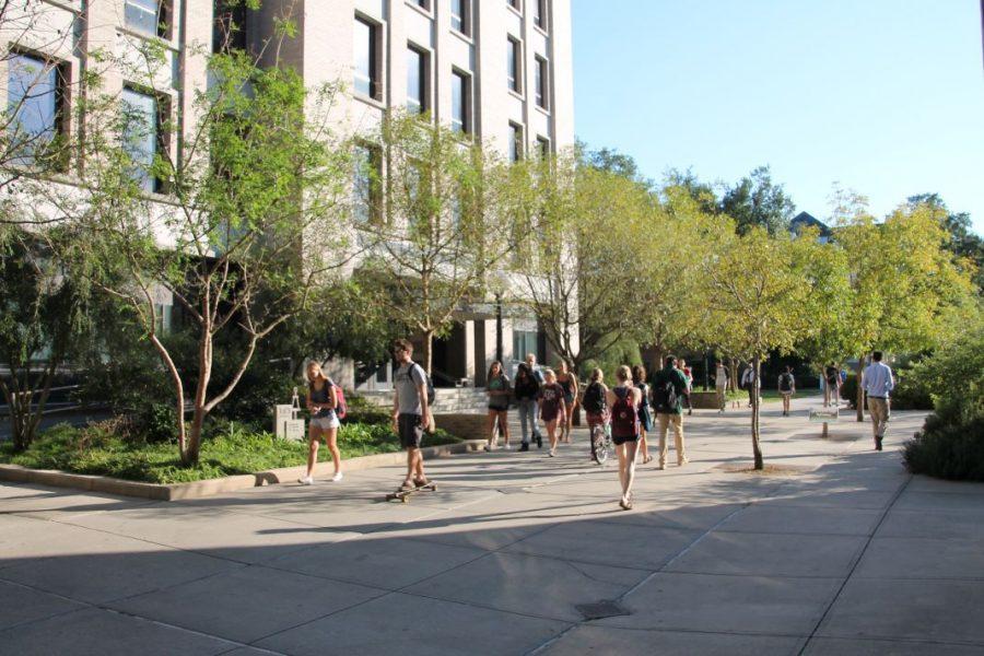 Students walk past Lindy Boggs Center for Energy and Biotechnology. Boggs houses some of Tulanes science and engineering departments, which have some of the largest gender disparities in their professorship.