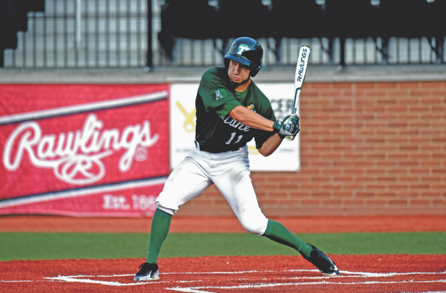 Junior outfielder Jarett DeHart swings the bat in the Fall Ball World Series. DeHart hit a home run in the first game of the series to contribute to the Green teams win, but the team ultimately lost the series to the Blue Team 3-2 on October 29.