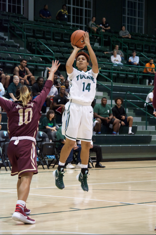 Freshman guard Taylor Emery shoots over sophomore guard Zoie Miller for a two pointer to contribute to Tulane’s win in her first Green Wave appearance against Loyola New Orleans on Nov 5 in Devlin Fieldhouse. 
