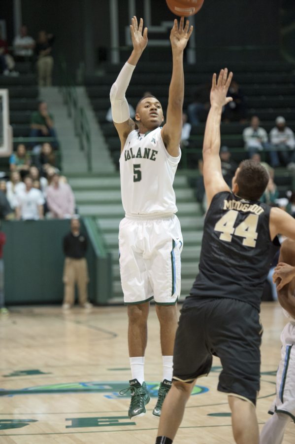 Redshirt sophomore guard Cameron Reynolds takes a shot in the Nov. 17 game against Wake Forest in the 2014-15 season. The Wave went 15-16 overall last season.
