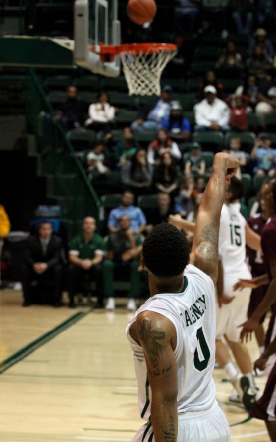 Louis Dabney shoots a 3 in the 68-67 overtime loss to Alabama A&M. Tulane shot 0 for 11 from the 3-point line in the first half of play.