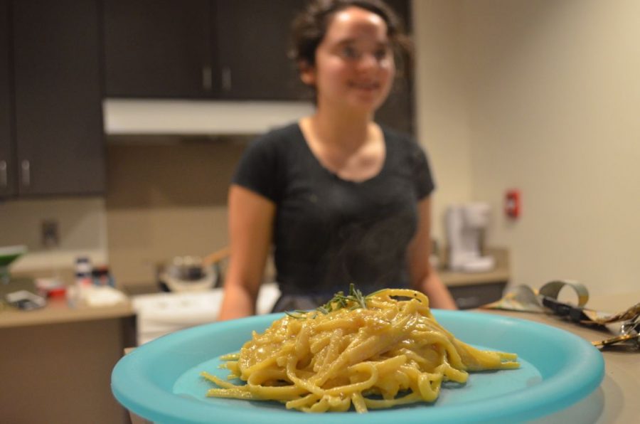 Maricela Murillo proudly stands behind her savory butternut squash dish. 