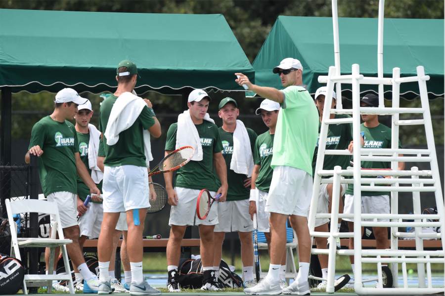 Tulane mens tennis team stands by the sidelines during a break in match play. The Wave hopes to rebound after a 4-3 loss against USC on Jan. 23, and will take on Harvard and Dartmouth this weekend.