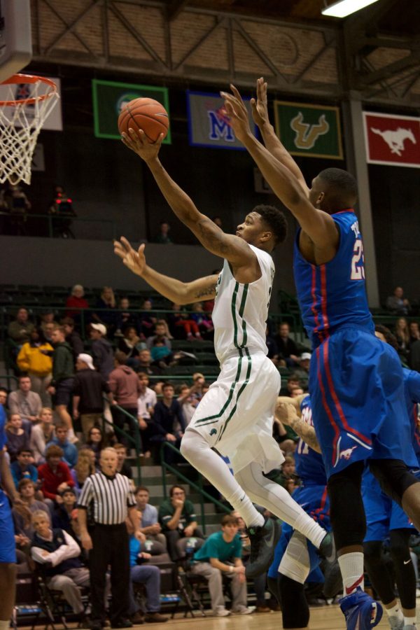 Redshirt junior guard Malik Morgan goes up for a lay up against a Southern Methodist University Mustang in a 60-45 loss this past season. 
