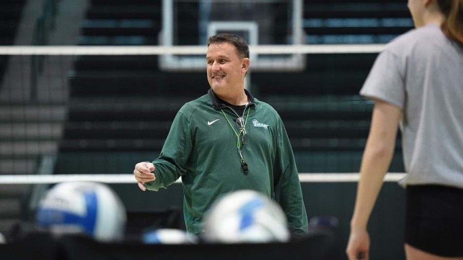 Jim Barnes, the new head coach for womens volleyball, prepares with his team in Devlin Fieldhouse. The Wave will begin their season in Hattiesburg, Miss. this weekend. 