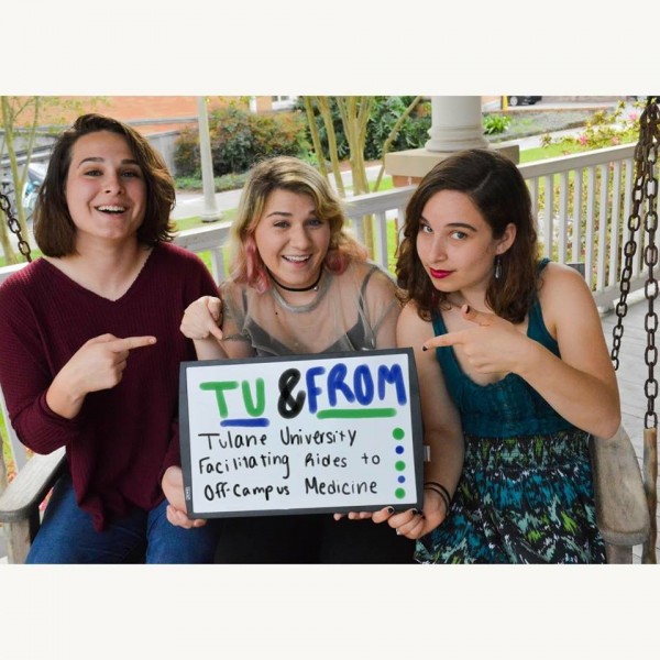(From left to right) Eva Dils, Corley Miller and Sarah Levison pose with a sign advertising the TU and FROM campaign. The program aims to increase access to off-campus health care providers for students. 