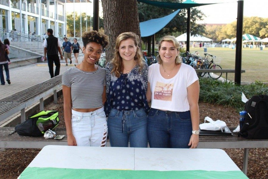 Co-producers of this years Hers, Theirs, Ours performance (from left) Jae Nichelle, Eliza Kauffman and Corley Miller pose at a tabling event promoting the show.
