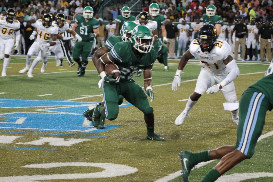 Senior running back Dontrell Hilliard makes a run for the Green Wave at Saturdays game in Yulman Stadium. 
