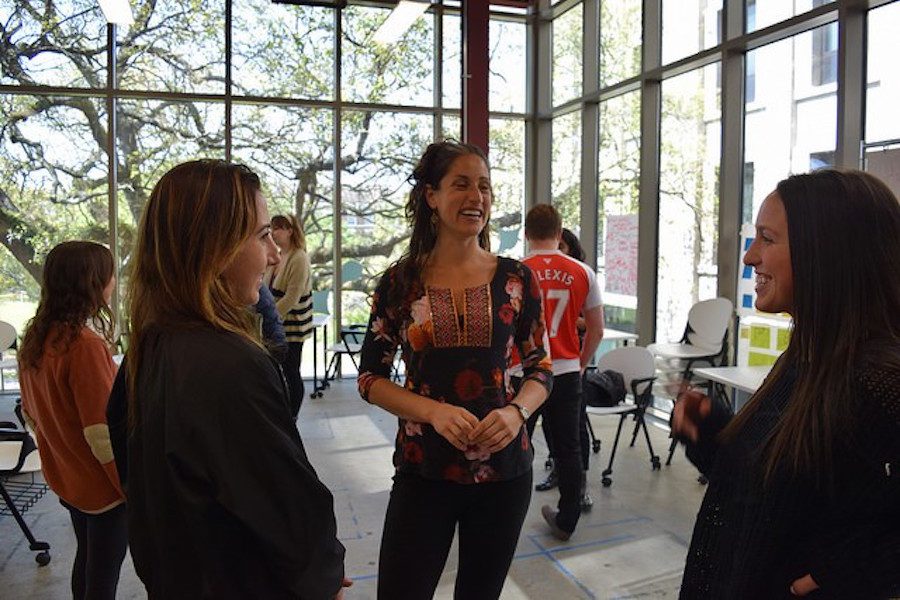 Professor Julia Lang talks with students at The Phyllis M. Taylor Center.