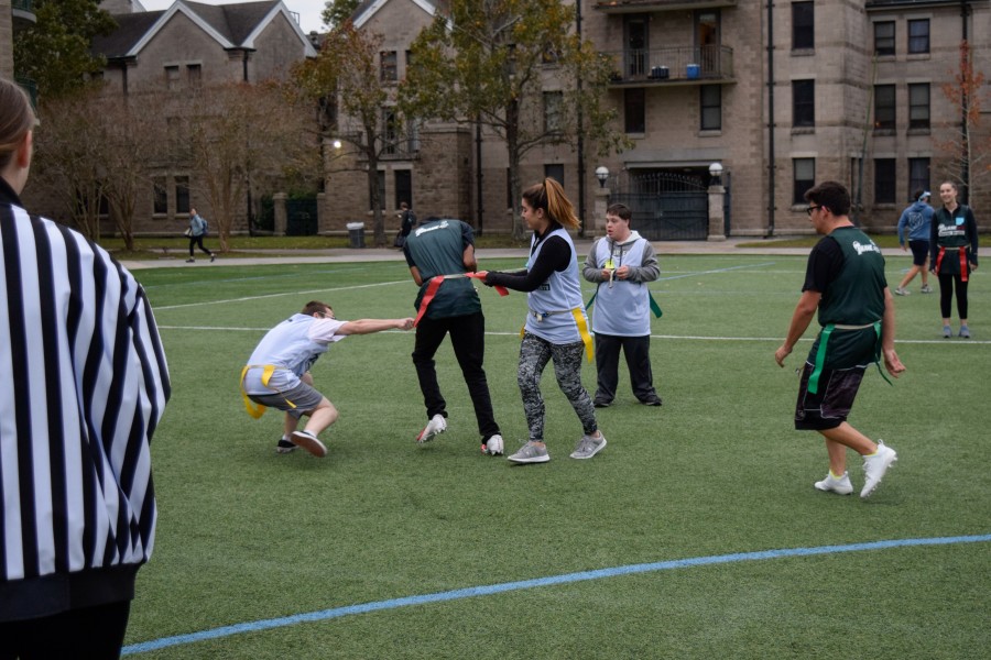 Special Olympics participants play flag football.