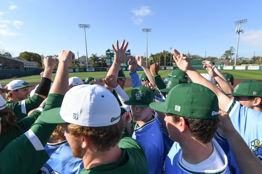 The Green Wave baseball team huddles before a scrimmage on Friday as the team prepares for the upcoming 2020 season.