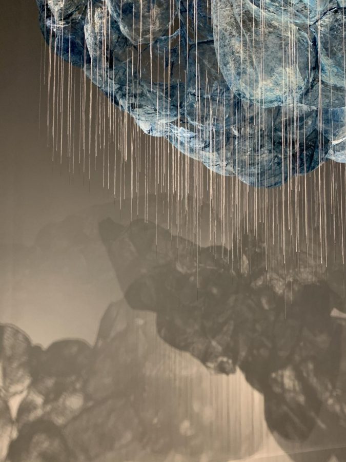 picture of cloud art exhibit with needles hanging down at a museum