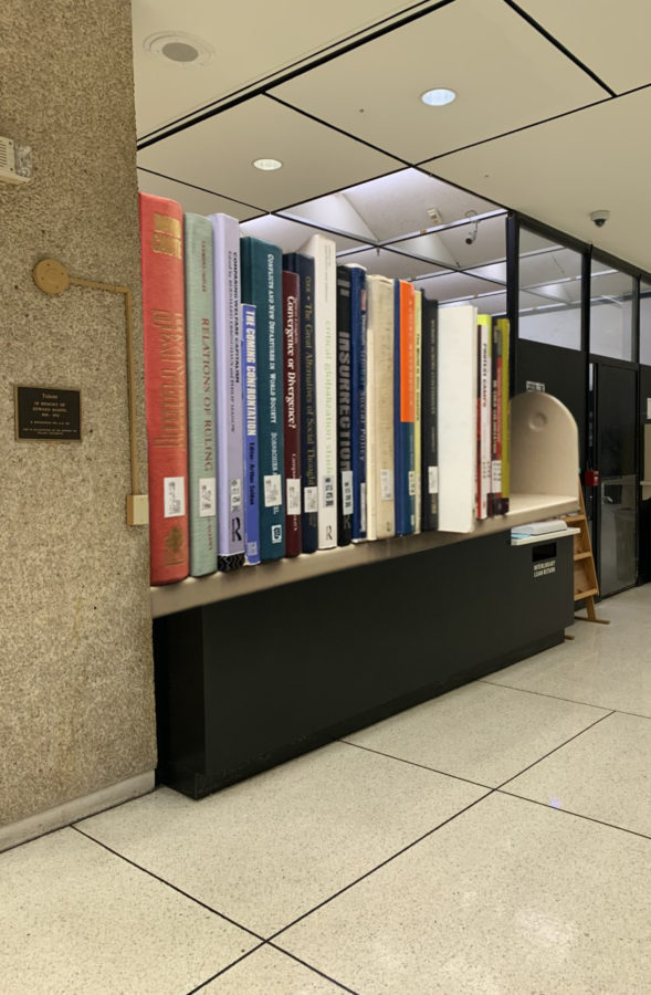 A photograph of the reference desk on the ground floor of Howard-Tilton Memorial Library.