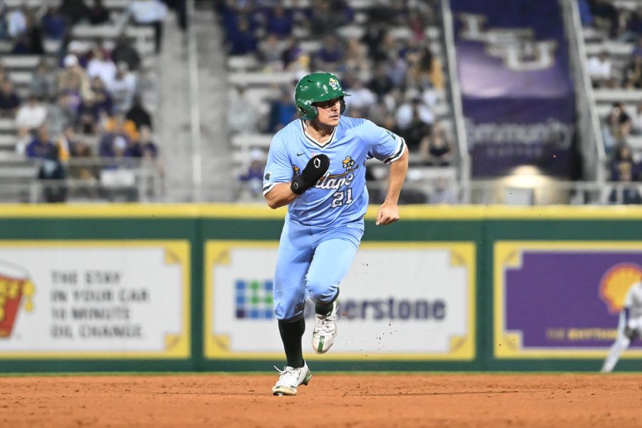Redshirt senior and designated hitter Luis Aviles sprints from second to third against LSU.