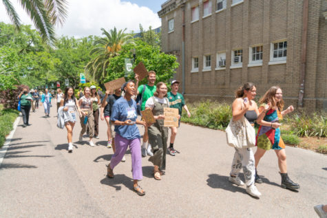 Protestors marched through campus to Gibson Hall on Earth Day to protest Tulanes investment in fossil fuels last April.  