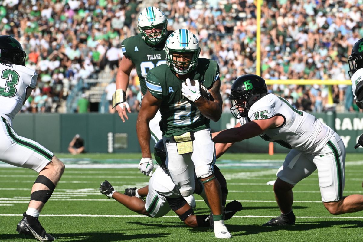 Running back Makhi Hughes dodges the North Texas defense during the Green Waves homecoming win on Saturday, Oct. 21, 2023 in Yulman Stadium. 