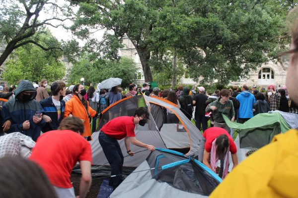 Pro-Palestinian protestors pitched a tent encampment Monday evening and linked arms to protect it from police. The encampment remained outside of Gibson Hall on Tuesday. 