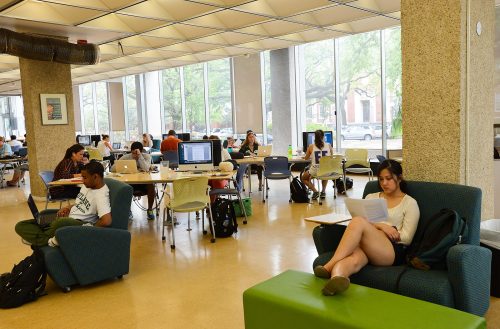 Students pictured on a floor of the library that closes at night.