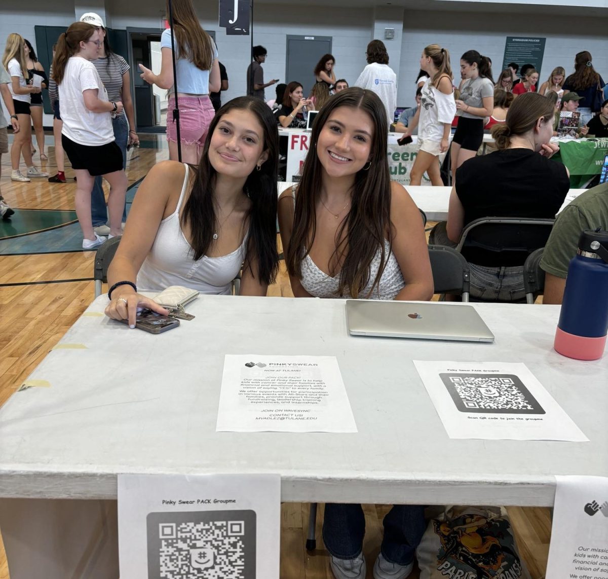 President Mandi Valdez and Vice President Ella Milchan tabling for Tulane's Pinky Swear Pack.