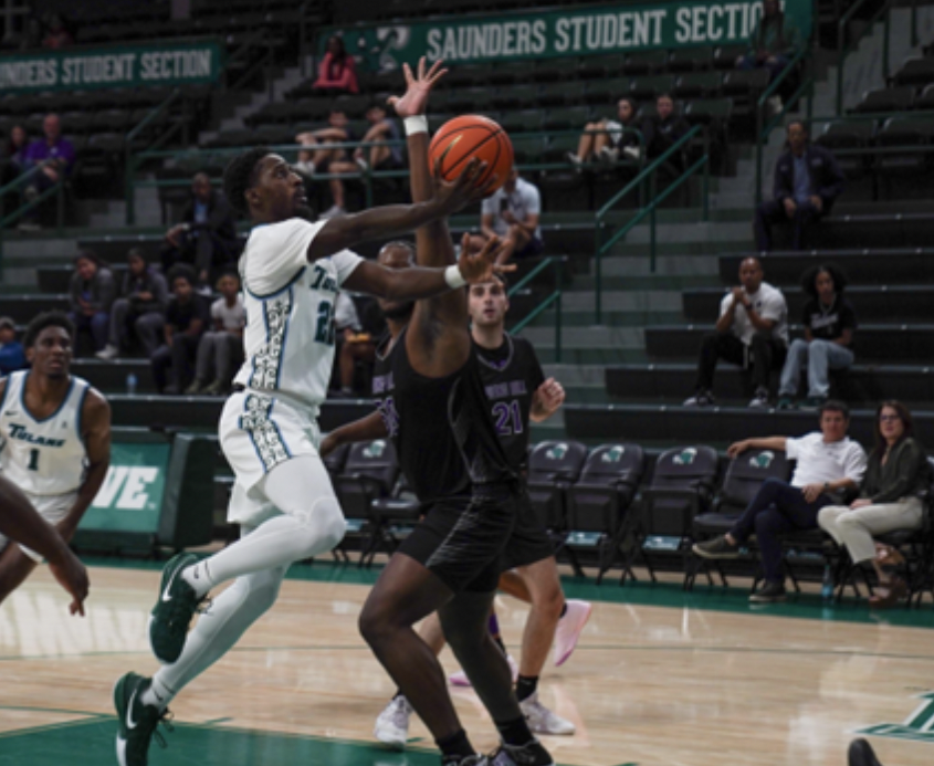 Guard Asher Woods attempts a layup vs. Spring Hill in the first half.