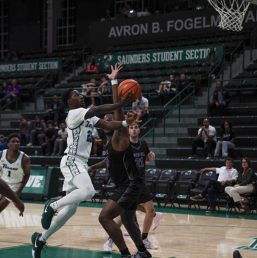 Guard Asher Woods attempts a layup vs. Spring Hill in the first half.