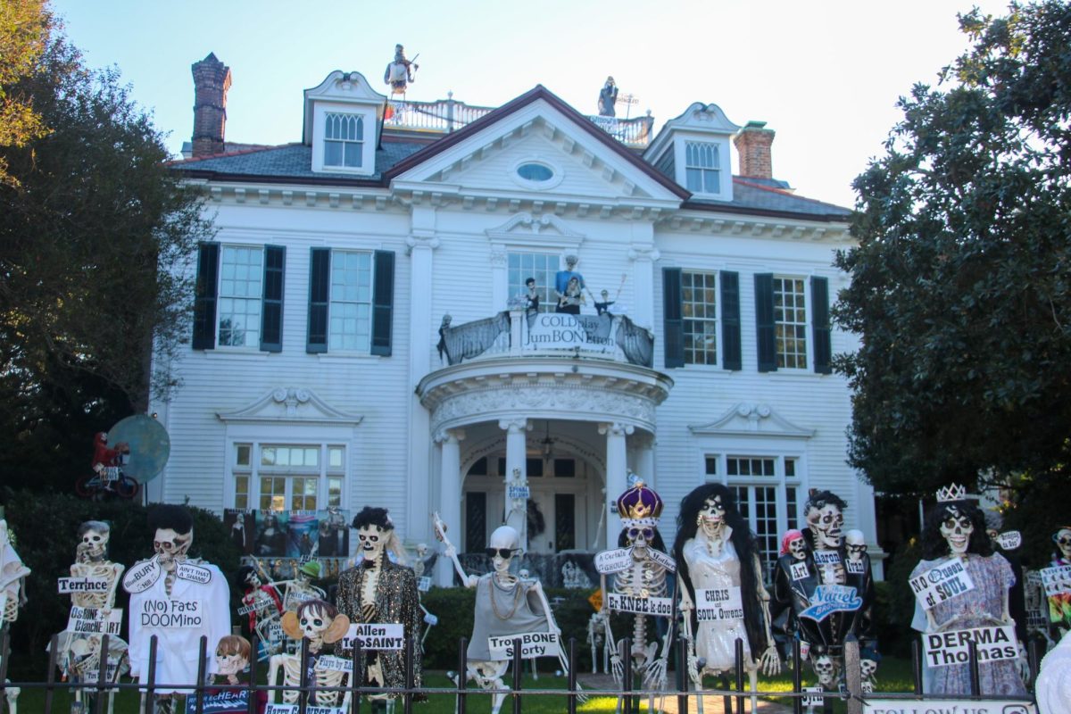 Skeleton Soirée — Dozens of skeletons celebrate in front of the grand Skeleton House, each adorned with clever puns and costumes. 