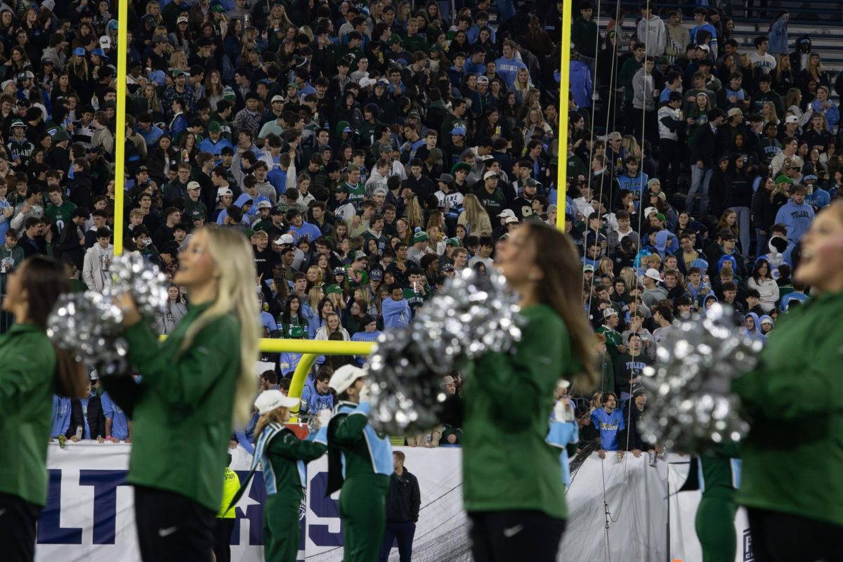 The Tulane cheer team and marching band perform in front of the student section before the game