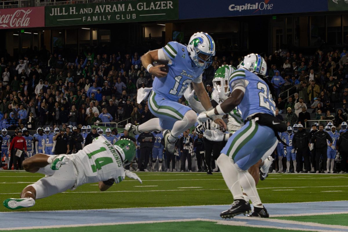 Tulane quarterback Jake Retzlaff scores a touchdown during the American Conference Championship
