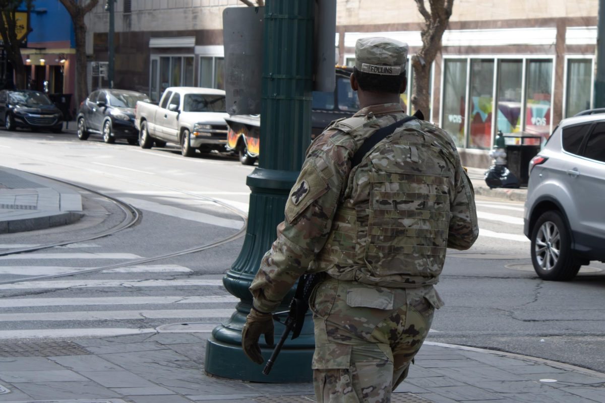 A soldier from the Louisiana National Guard crosses Canal Street