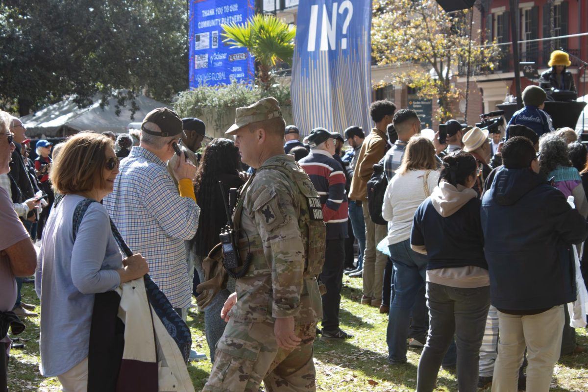 A soldier from the Louisiana National Guard patrols through a crowd at an event celebrating the inauguration