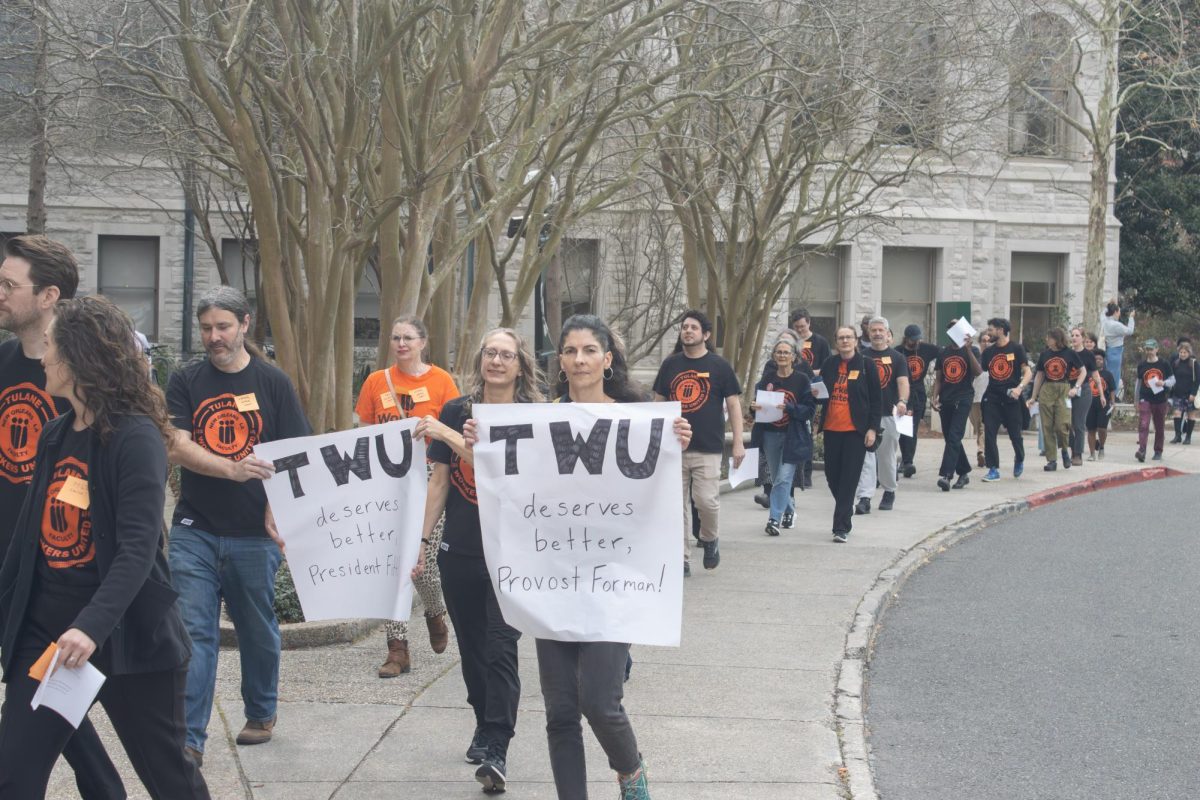Members of TWU gathered on St. Charles Avenue and then marched into Gibson Hall to call out President Mike Fitts' salary increase amidst union negotiations.