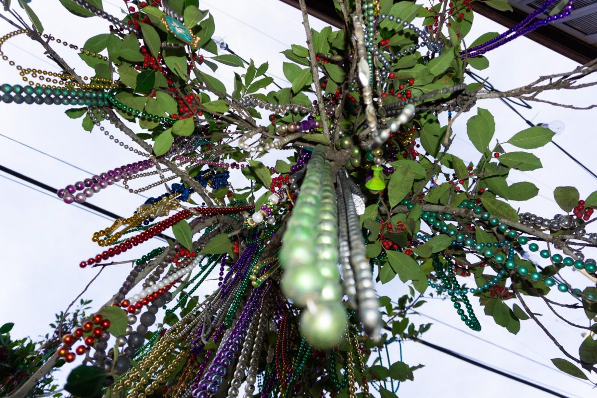 Hundreds of beads hang from trees outside The Boot Bar & Grill.