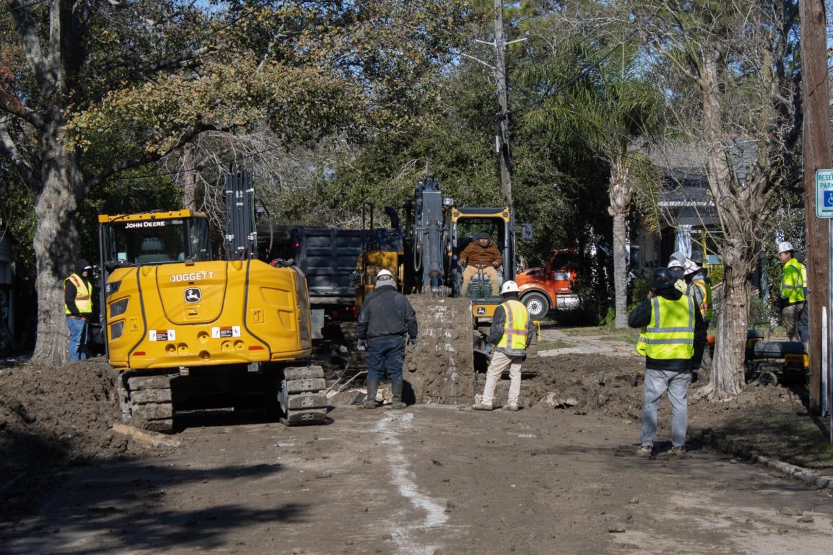 Crews work at the site of a water main break on March 1 on Panola Street.